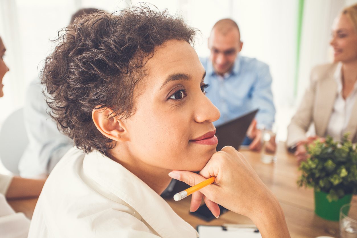 Businesswoman looking away and projecting how she will have finished her project by the end of the year.